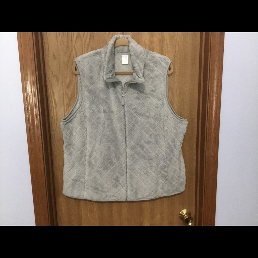 Fluffy grey vest.
